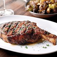 Grilled Bone in Rib Steak with one Free Side Dish